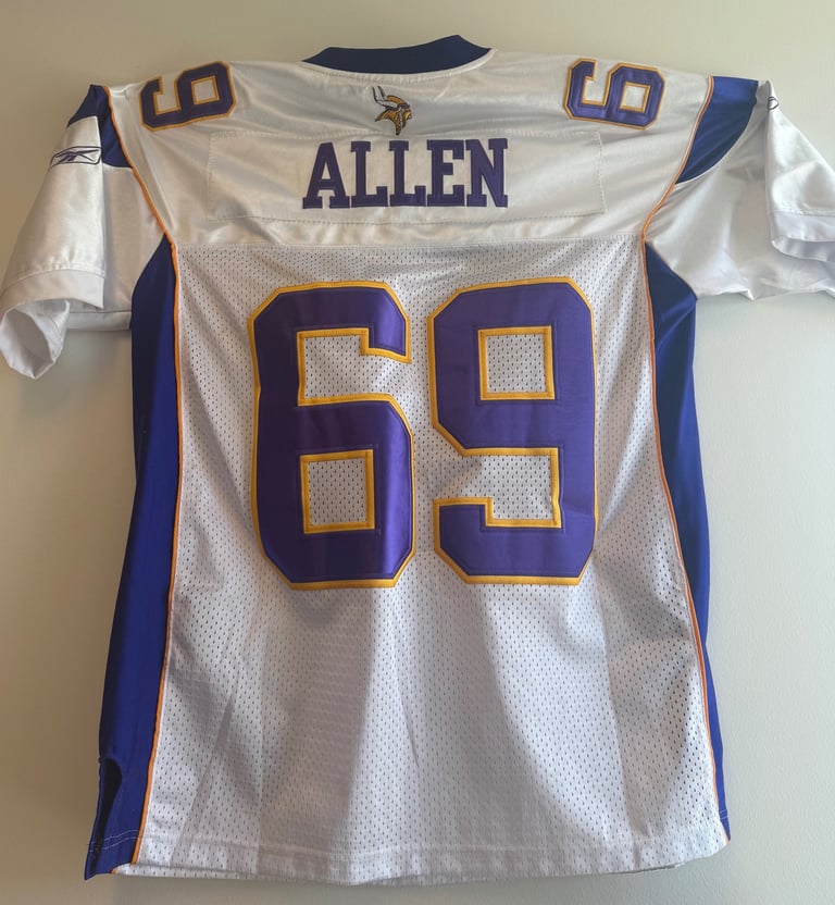 White NFL football jersey number 69 with purple and gold trim, displaying name ALLEN on the back