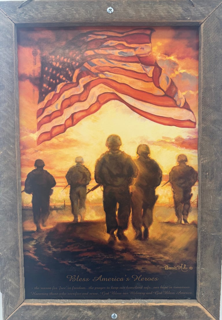 Silhouettes of five soldiers standing together against a dramatic sunset with the American flag waving above them. Text reads Bless Americas Heroes